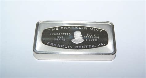 883 oz of silver lot 302 - 30 in round metal and wood. . Franklin mint 1000 grains sterling silver value